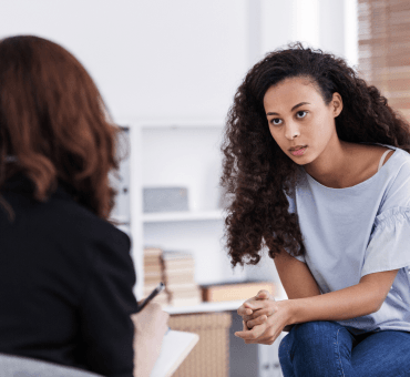 professional-counselor-and-woman-suffering-from-de-2021-08-27-14-49-08-utc 1
