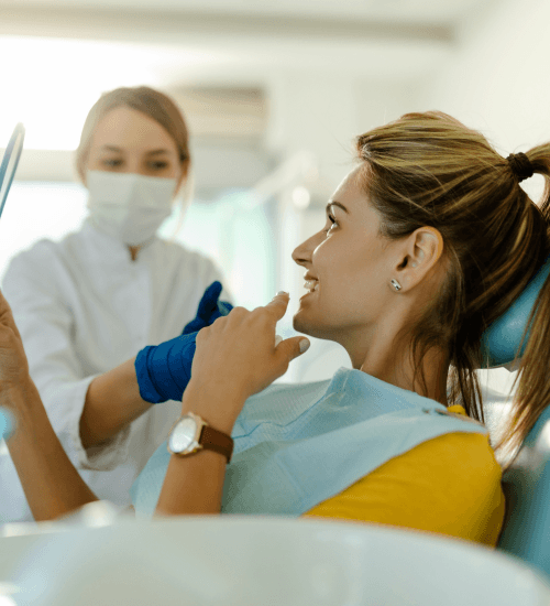 dentist-and-patient-in-dentist-office-dentist-hol-2021-09-03-03-12-59-utc 1