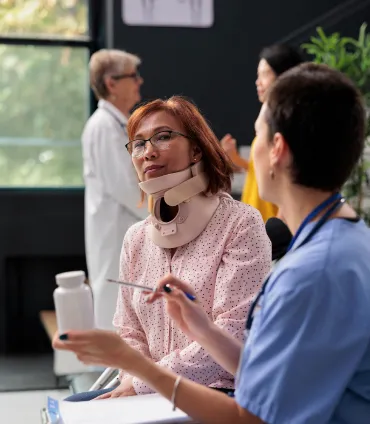 senior-patient-with-cervical-neck-collar-2022-11-10-00-36-42-utc 1