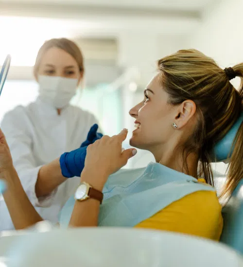 dentist-and-patient-in-dentist-office-dentist-hol-2021-09-03-03-12-59-utc 1